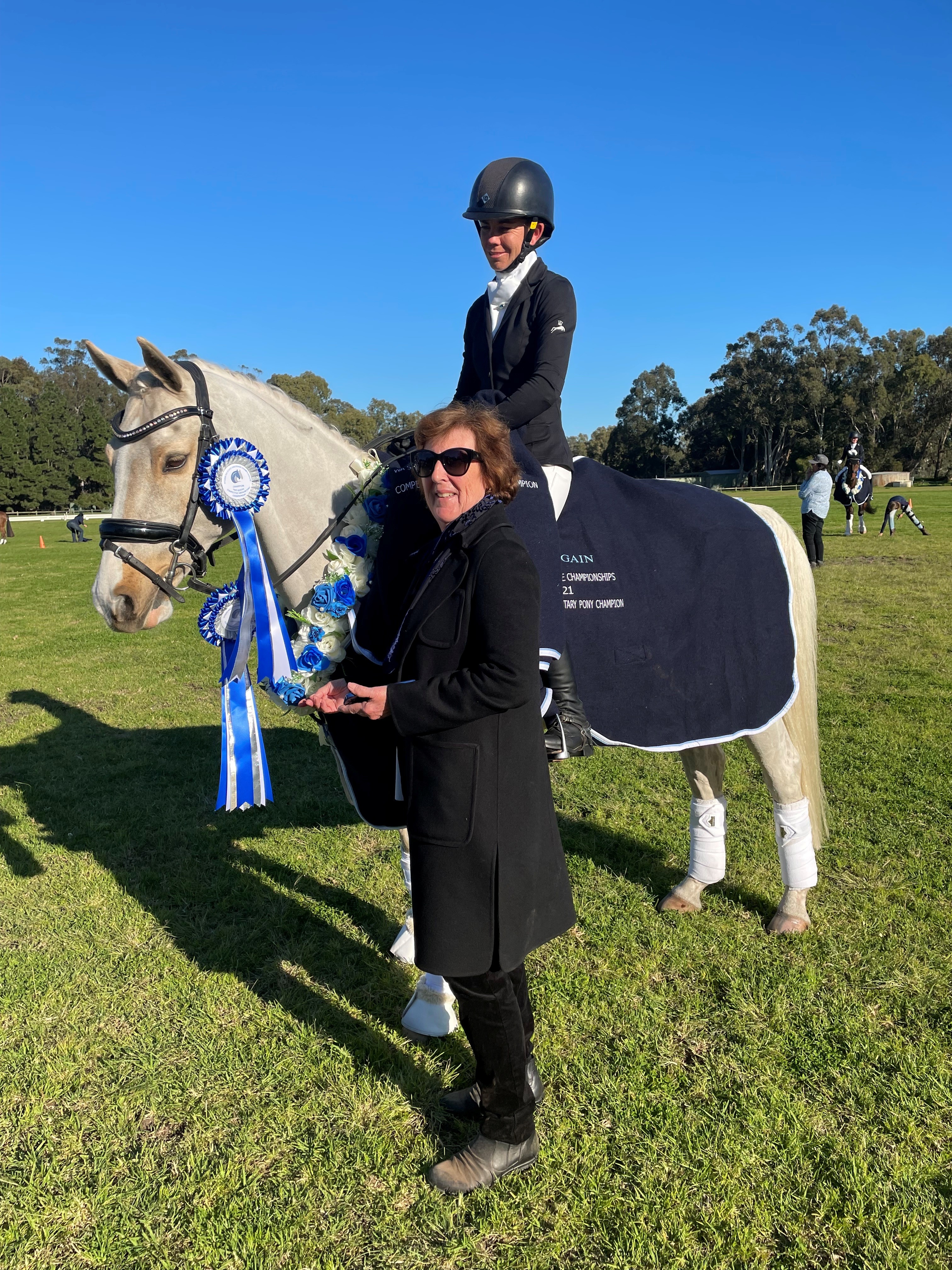Photo of Gill Botten(owner)with Tegan Cook riding Anjershoff Chico.