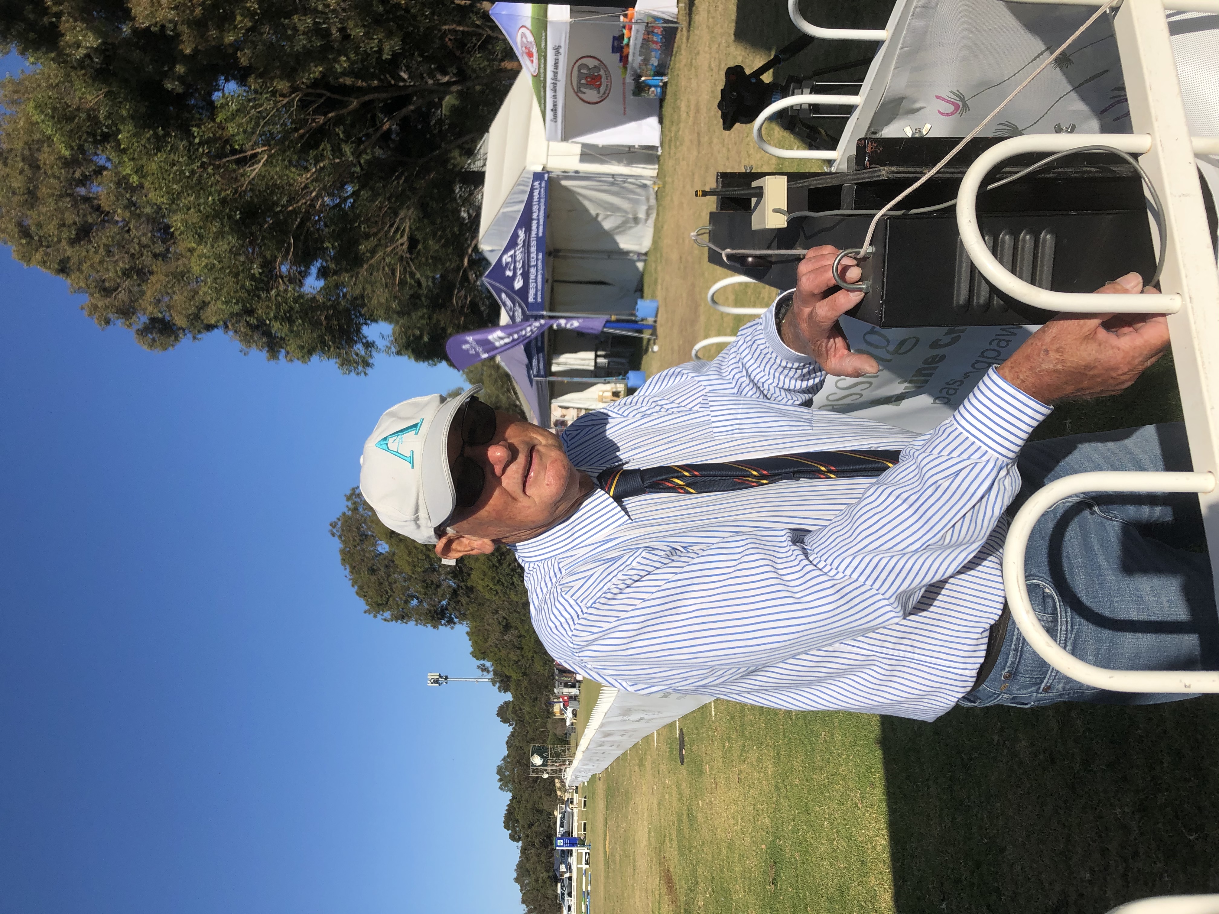 Fred Freeman setting up timing equipment at the State Jumping Championships.